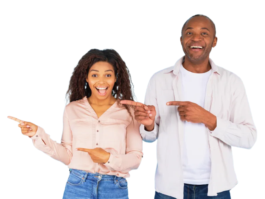 Happy couple pointing at orthodontics on blue background.